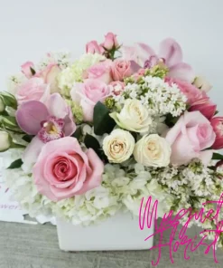 Lady in Pink: A Graceful and Delicate Floral Arrangement"